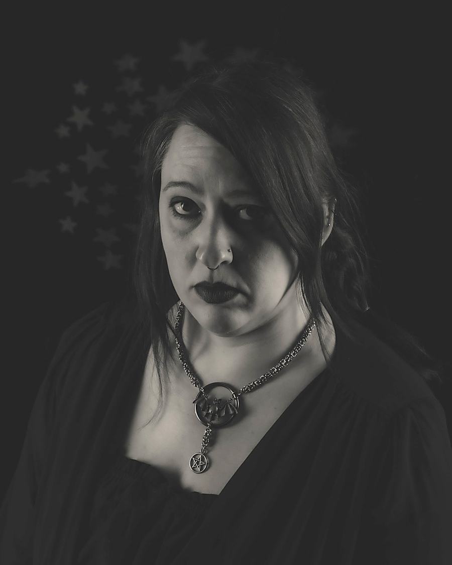 Melissa, founder of Ouroboros Opus, wearing the Vespertine necklace