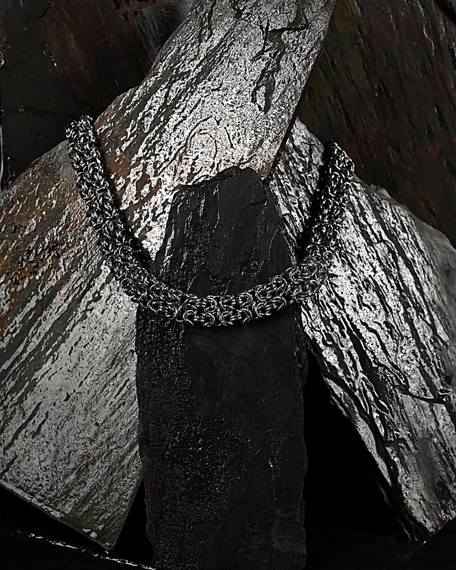 Byzantine chainmaille draped across slate
