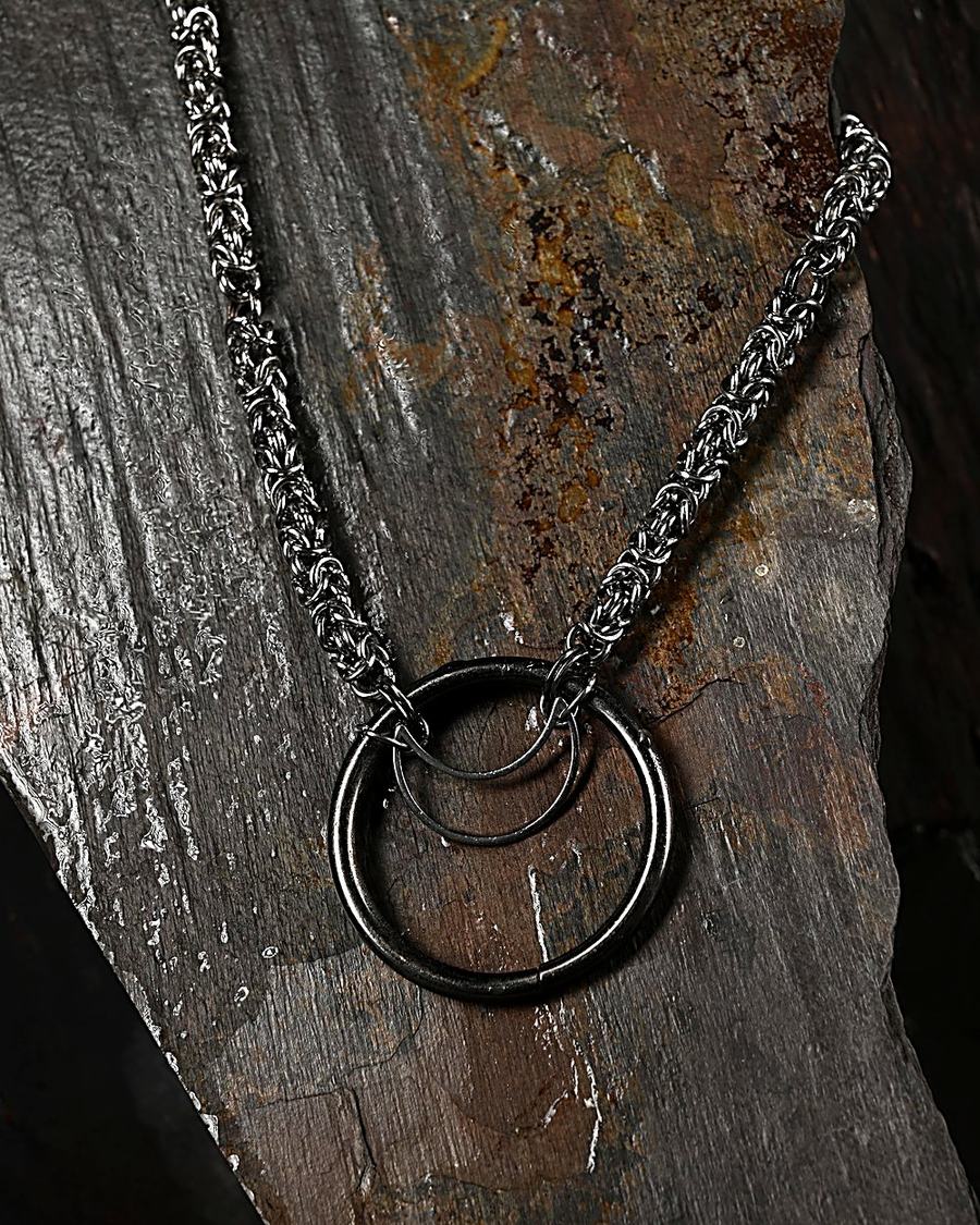 Forged O-ring focal joined into Byzantine weave
